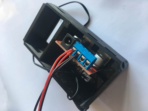 Close-up view of the interior of a Fourby Multifunction USB Clock, featuring the USB module and connected wires.